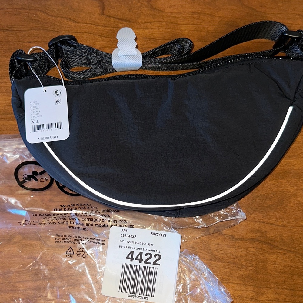 FP Movement Black Crescent Bulls Eye Sling Crossbody Bag w/ reflective trim NWT